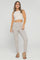 PANTALON SILUETA AJUSTADA CON PRENSES Y DETALLE