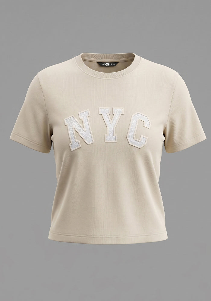 CAMISETA BASICA ALGODÓN CON BORDADO EN APLIQUE
