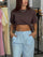 PANTALON SILUETA FLARED CON PRETINA RECOGIDA